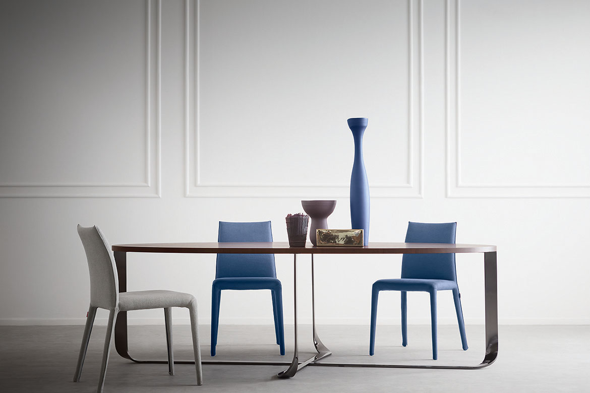 eliptic confluence table design Xavier Lust and emi chairs in fabric cover
