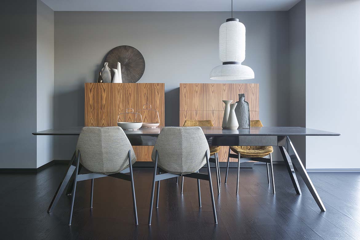 Delta table with glass top and gamma chairs with tubolar legs and tosca sideboards, design by Pianca