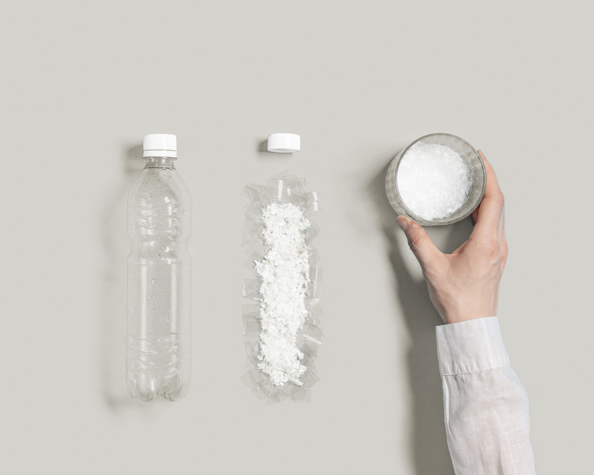 Glass of water with microplastic particles instead of clean water, plastic pollution concept, plastic garbage destructioned and has negative impact on environment, get into food and water, top view